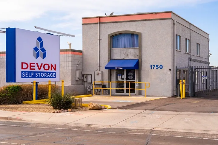 Devon Self Storage office building with signage and secure gated facility entrance